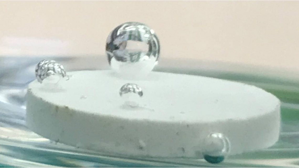 A drop of water on a pellet made of salt from the Dead Sea with low percent of a hydrophobic material